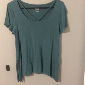 turquoise shirt with small cutouts at top